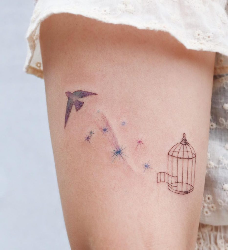 Bird fly tatto of cage